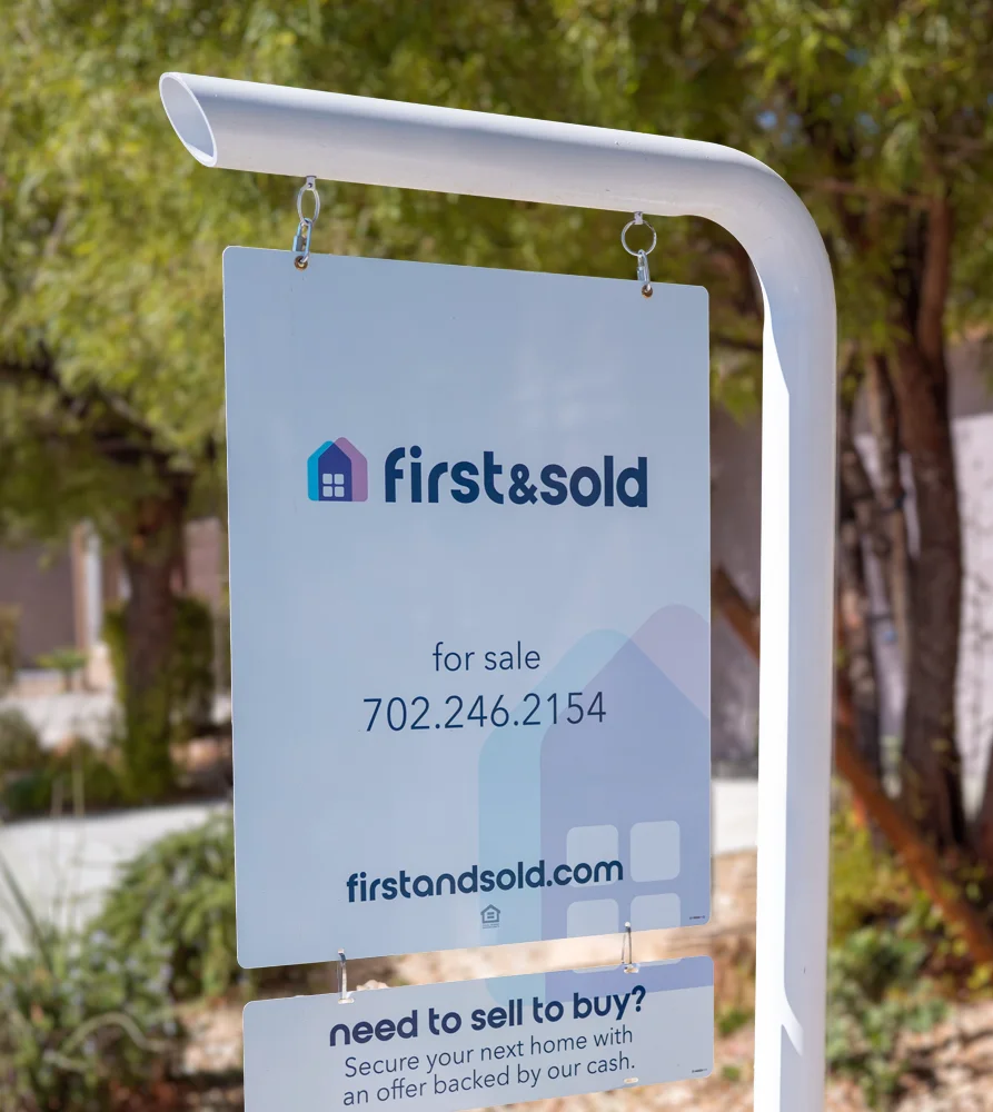 First and Sold real estate sign